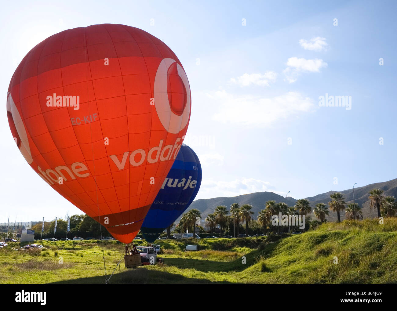 Torremolinos,Costa del Sol, Malaga Province, Spain. Two hot air balloons advertising Vodafone and Acquajet Stock Photo