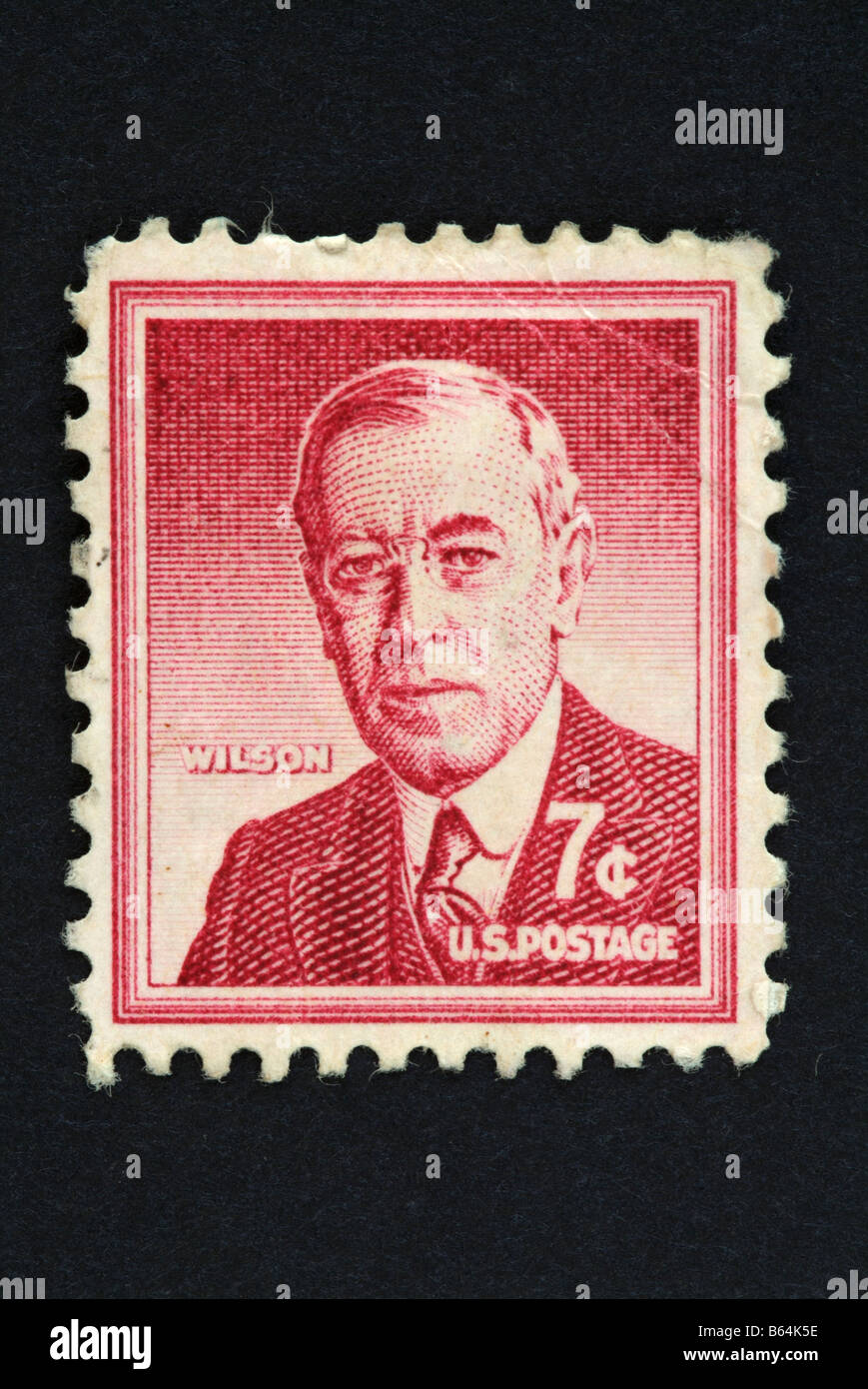 A seven cents US postage stamp with the image of Woodrow Wilson. Stock Photo