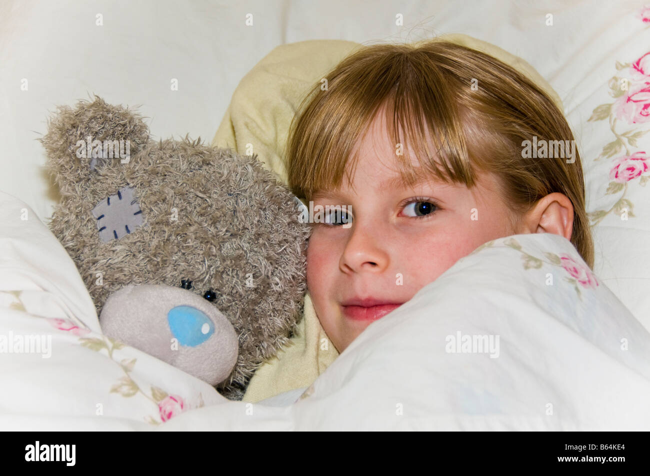 Child tuck in bed hires stock photography and images Alamy