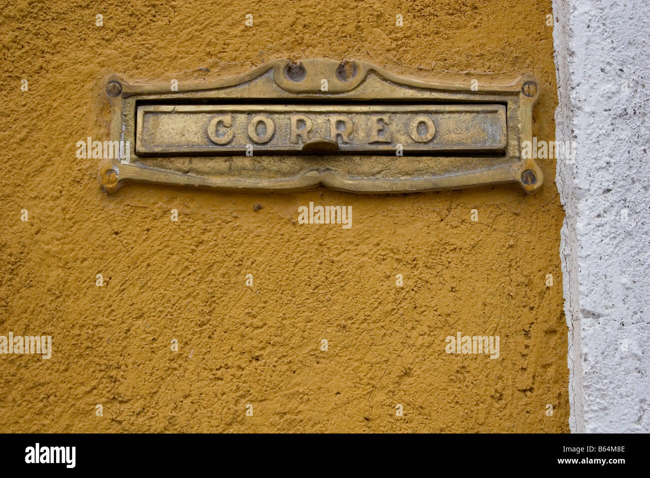 Letterbox or mail slot in colorful building in San Miguel de Allende