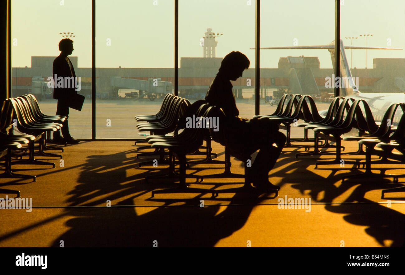 Commercial Airliner parked at Terminal,Passengers in terminal awaiting flights  Hartsfield International , Atlanta, Georgia Stock Photo