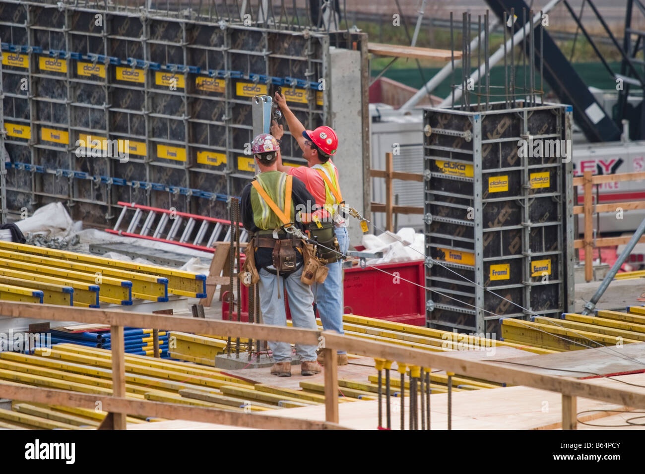 Workers at a construction site Stock Photo - Alamy
