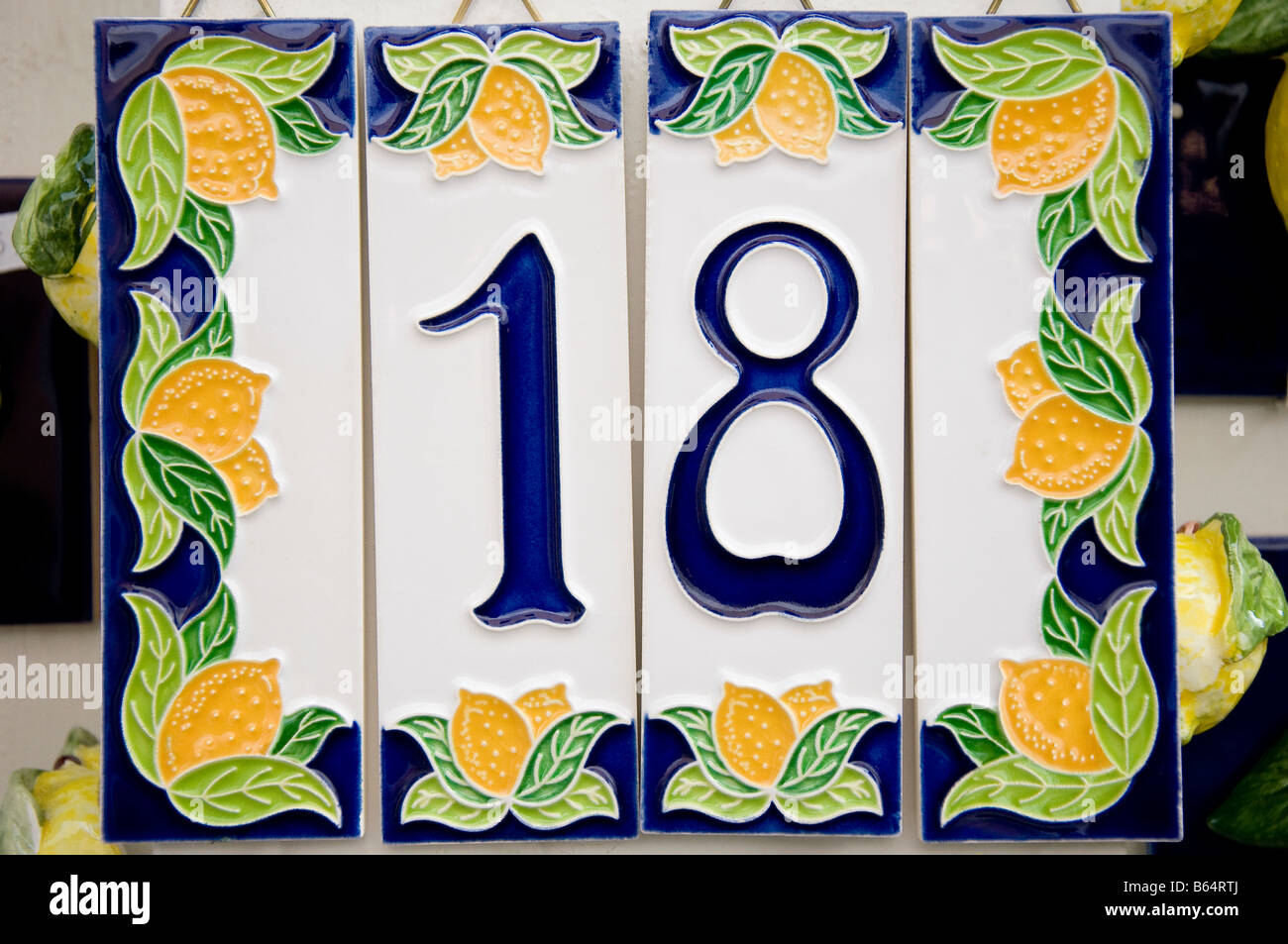 House number 18 and lemons on a ceramic tile for sale with price labels removed Limone sul Garda Lake Garda Italy Stock Photo
