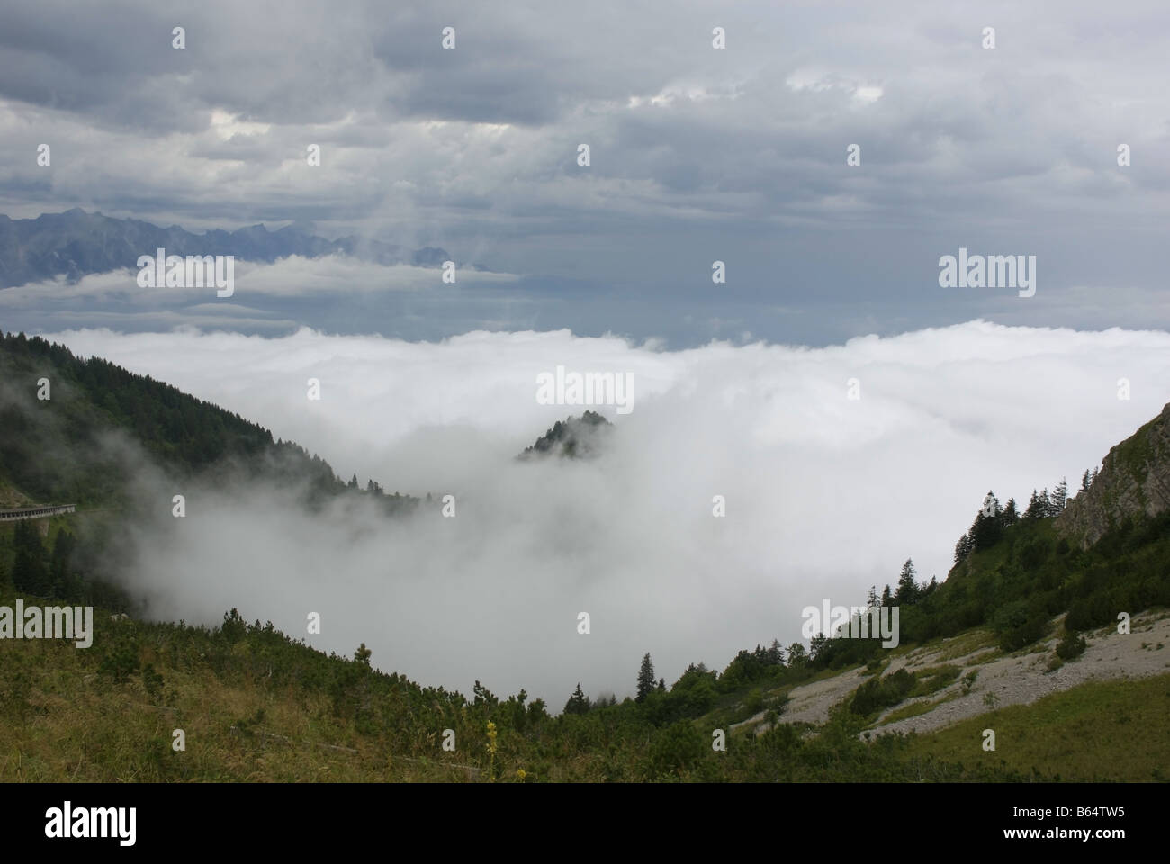Low cloud fills the valley in the Bernese Alps Taken from La Dent de Jaman near the town of Montreaux Switzerland Stock Photo