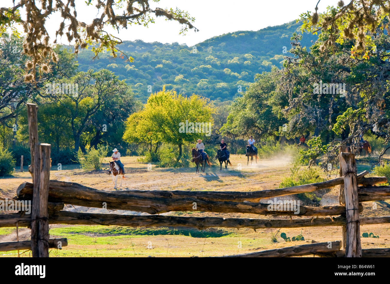 Texas Hill Country, Dixie Dude Ranch, riders returning to corral at days end Stock Photo