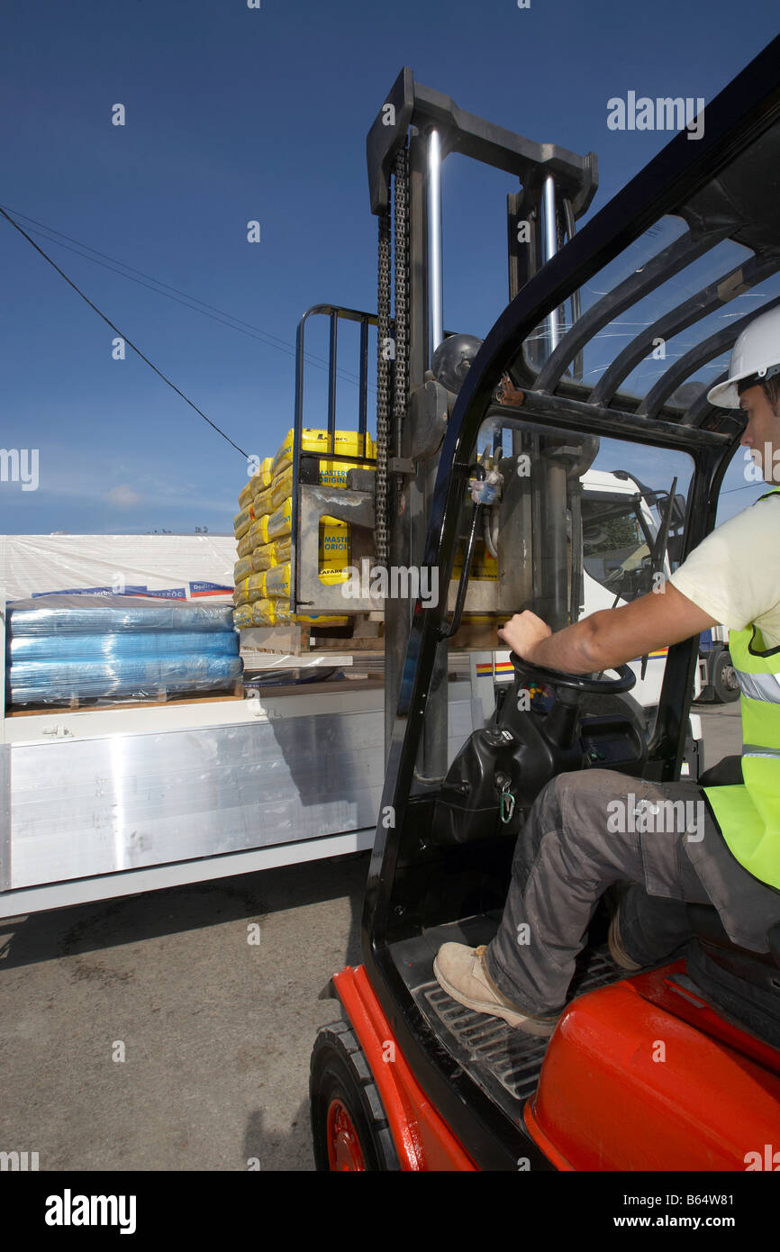 Construction Worker operating Crane and Fork Lift Stock Photo Alamy