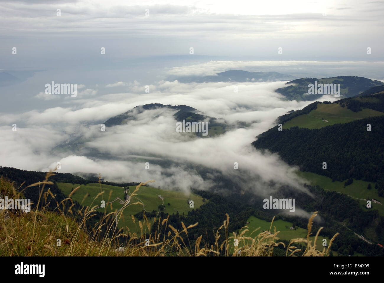Switzerland's Bernese Alps with low cloud Photographed from the peak of La Dent de Jaman looking out over Lake Geneva Stock Photo