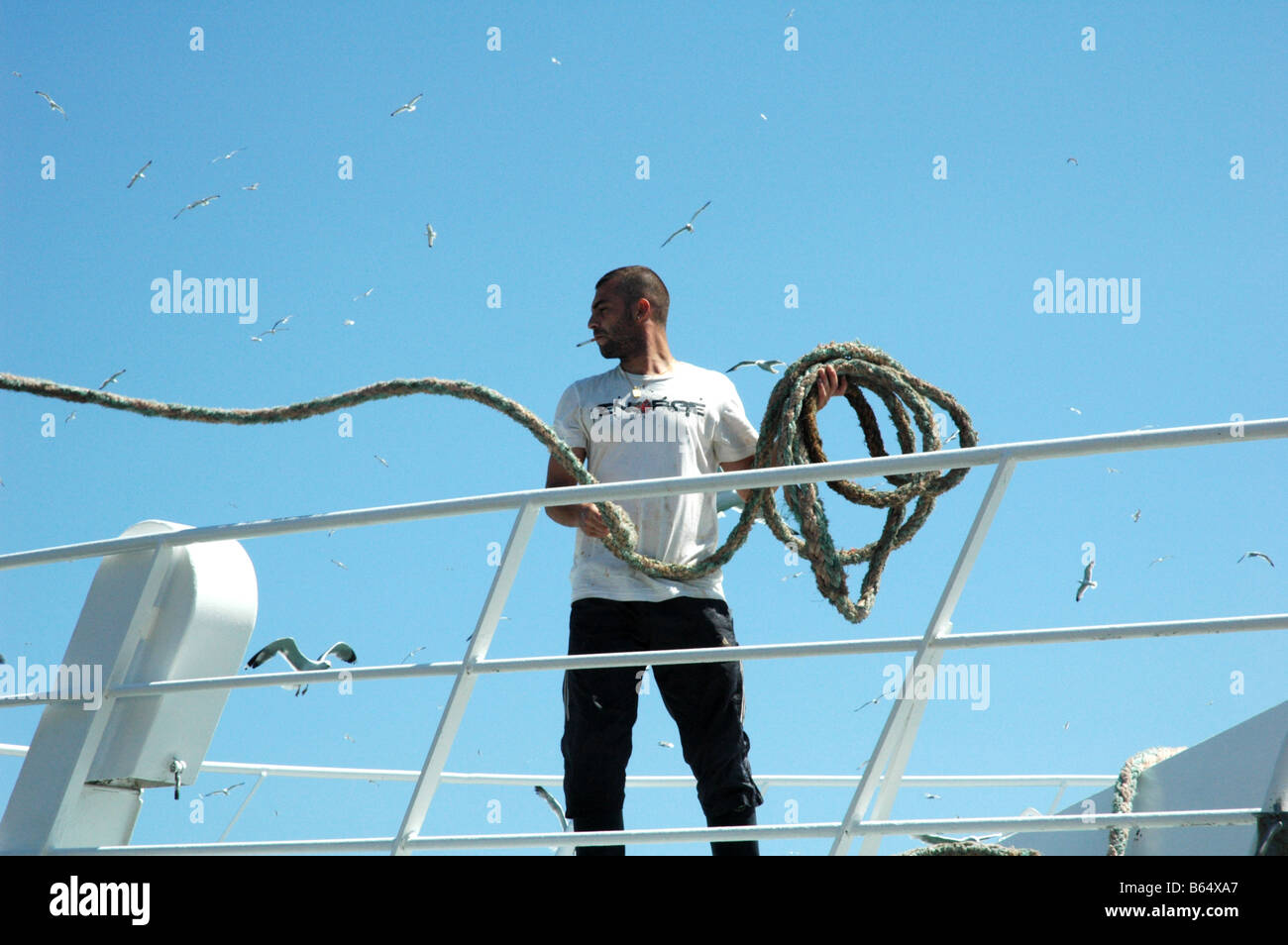 Fisherman casts a rope at SETE known as the Venice of Languedoc Stock Photo