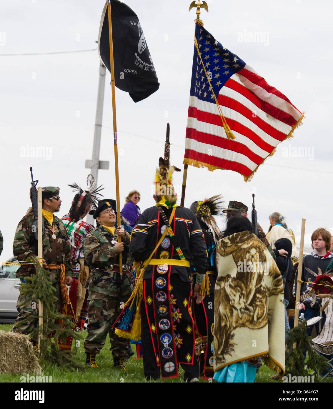 Native Americans at the Healing Horse Spirit PowWow in Mt. Airy, Maryland carry an American flag POW-MIA flag. Stock Photo
