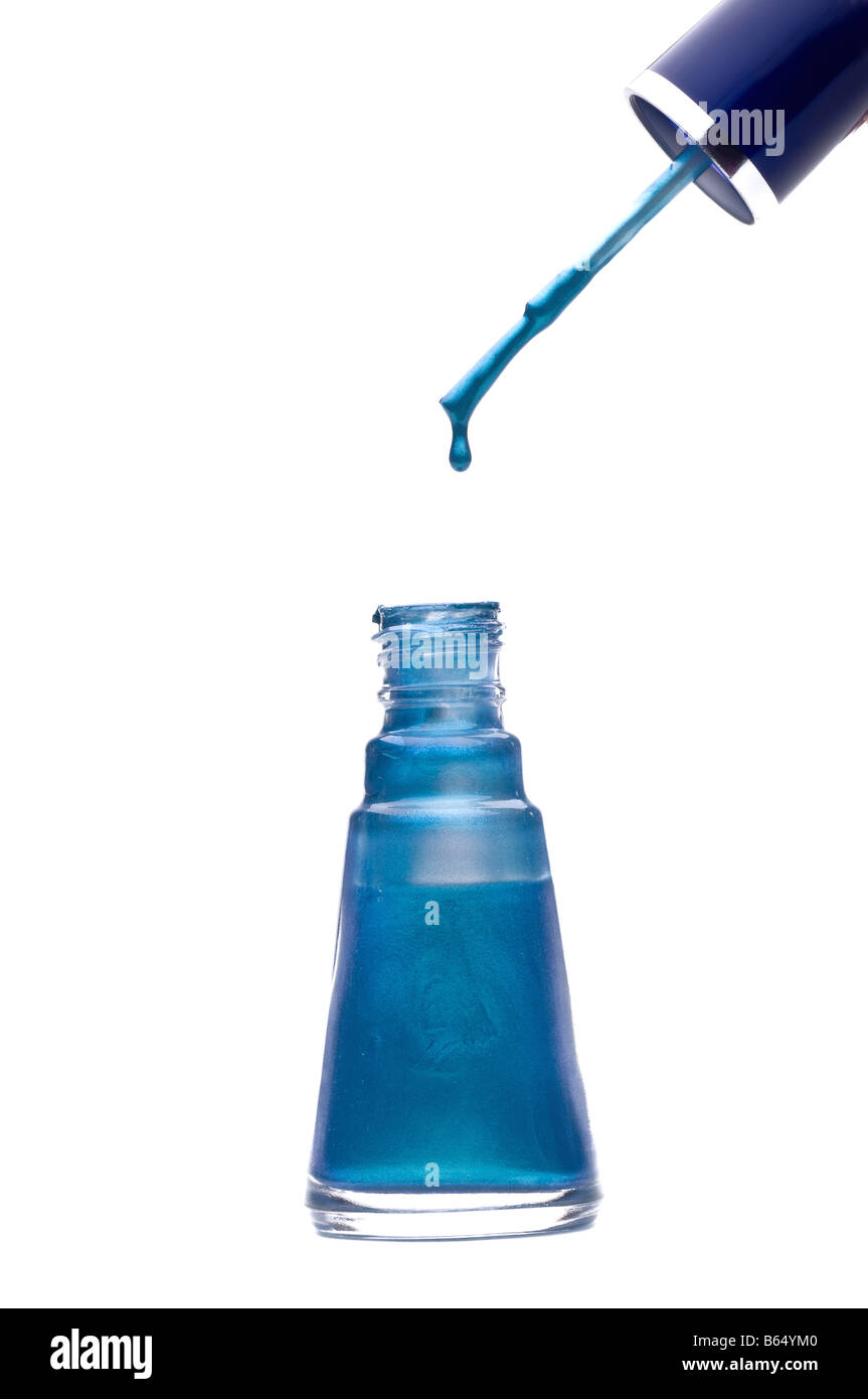 Blue nail polish dripping from the applicator brush Stock Photo Alamy