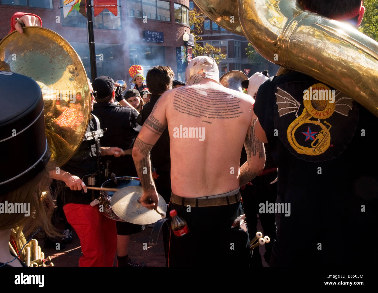 The tattooed drummer: Heavily tattooed street musician performing for the crowd during Oktoberfest festivities, Stock Photo