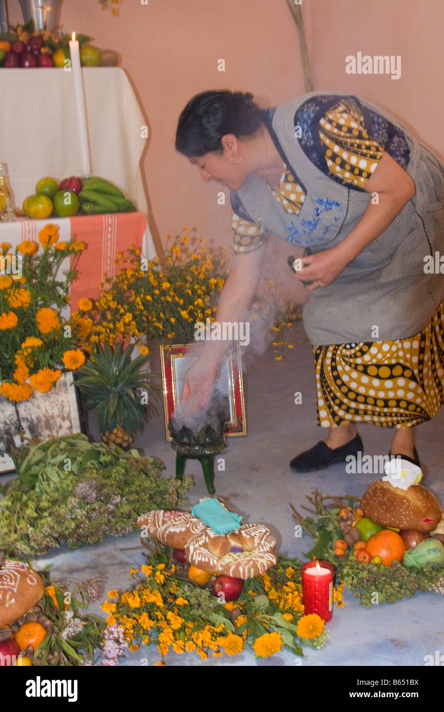 Matatlan, Oaxaca, Mexico. Zapotec Woman Spreads Incense Around the