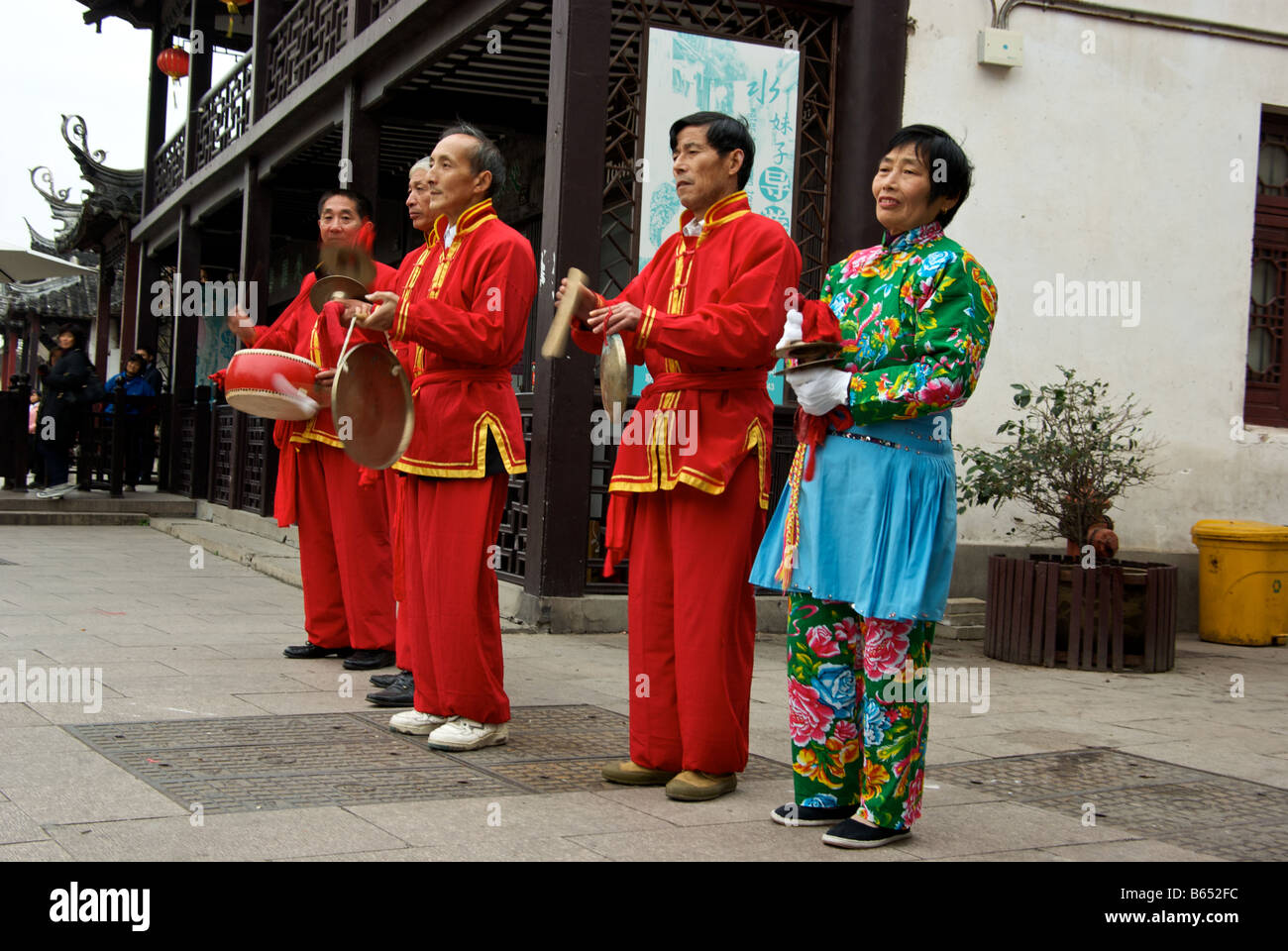 Chinese Musicians In Motion Blur Wearing Traditional Garb Playing