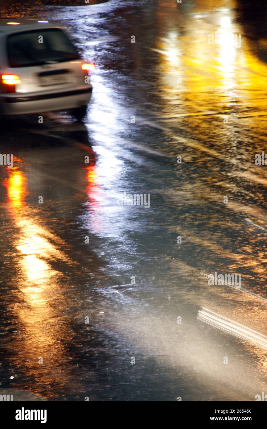 fast car driving in heavy rain at night in town Stock Photo - Alamy