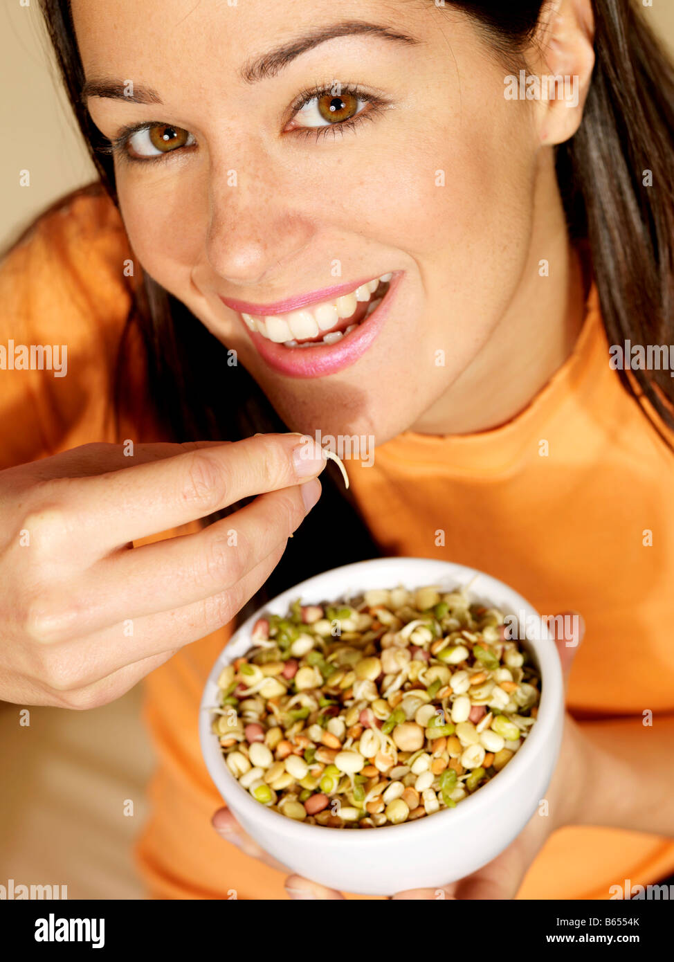 Young Woman Eating Mixed Beans Model Released Stock Photo - Alamy
