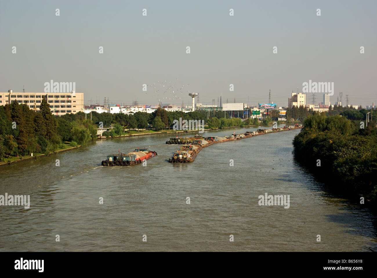 Beijing to Hangzhou Grand Canal is busy with motorized barges carrying construction gravel Stock Photo