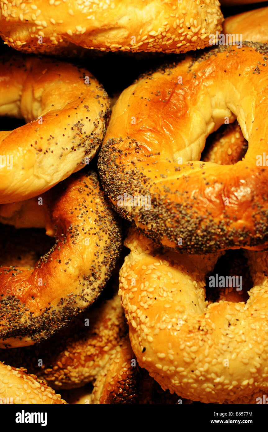 Fresh Montreal bagels, sesame and poppy, black seeds, piled together. Montreal (Canada) is known for this east-European treat. Stock Photo