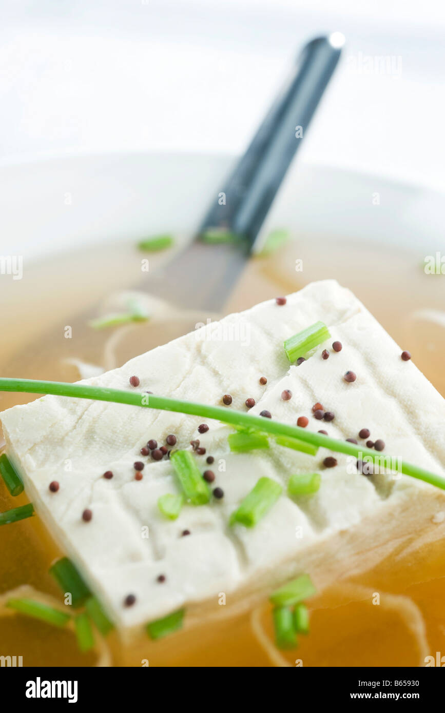 Block of tofu in miso soup, close-up Stock Photo