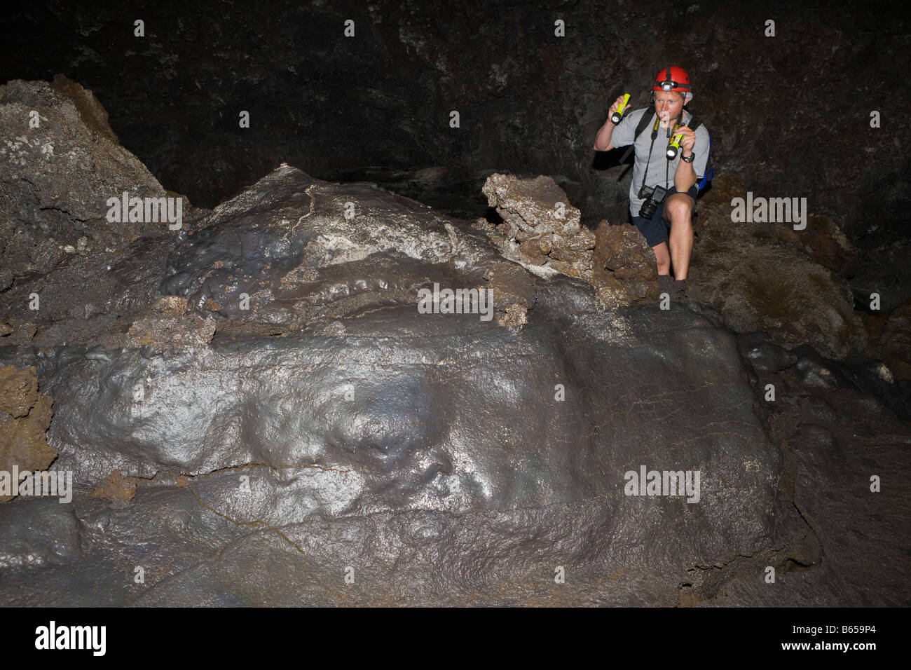 Tourist in biggest Portugese Volcanic Cave Gruta das Torres Pico Island Azores Portugal Stock Photo