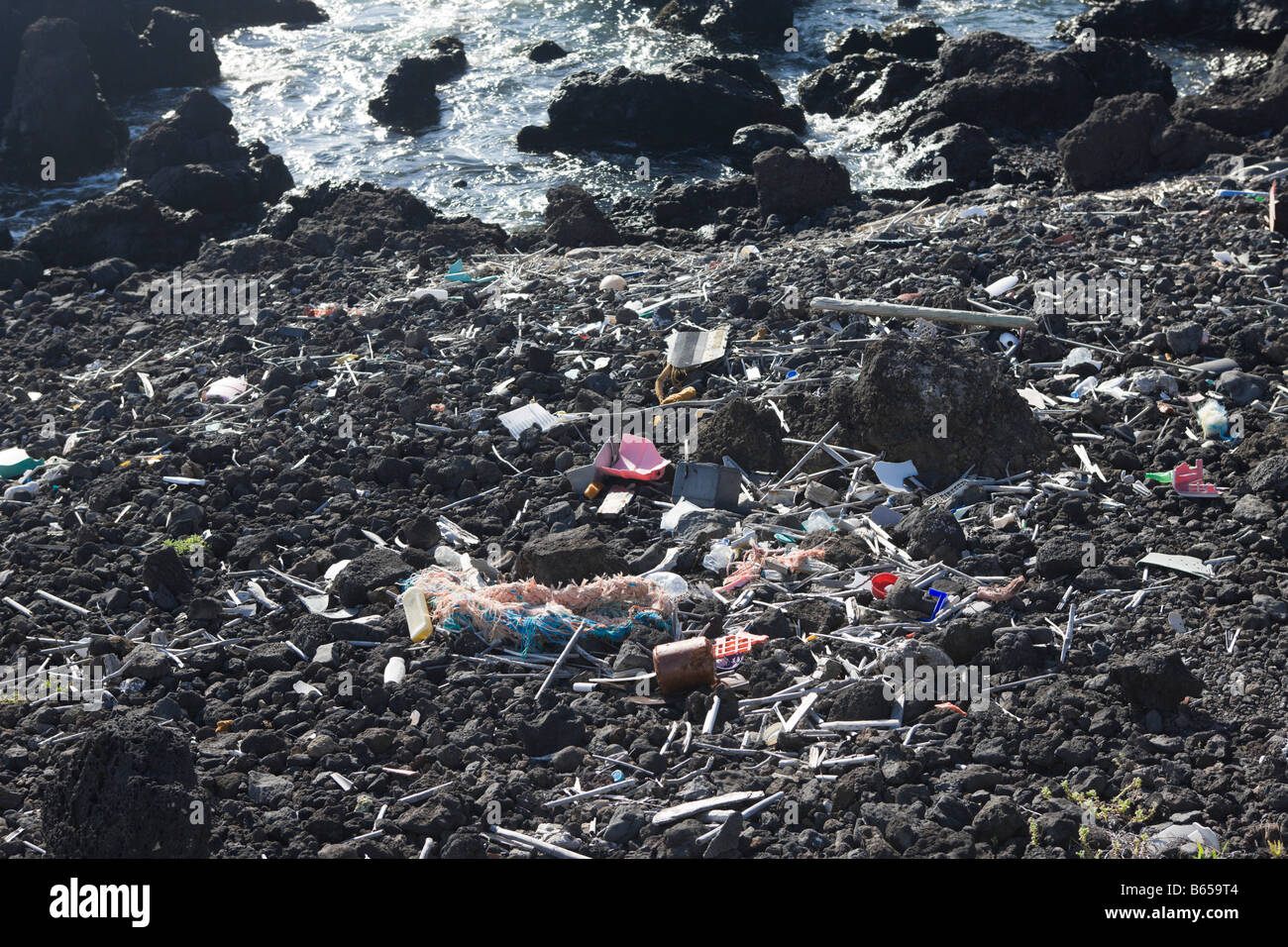 Rubbish comes with the High Tide Pico Island Azores Portugal Stock Photo