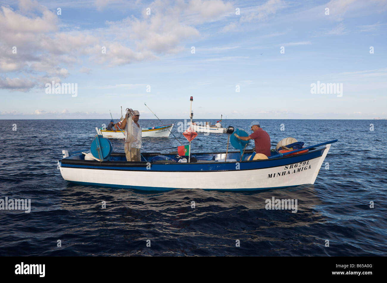 Fisherman hunting Veined Squids Loligo forbesi Azores Atlantic Ocean Portugal Stock Photo