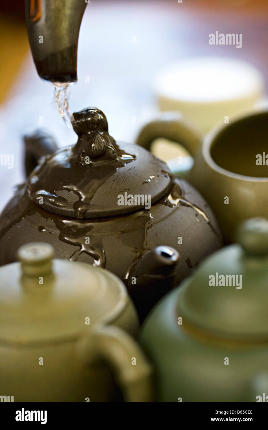 Chinese tea ceremony, warming the brewing pot before steeping the leaves Stock Photo