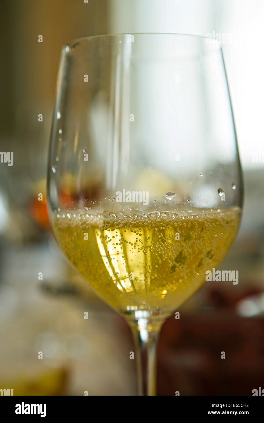 Glass of sparkling white wine Stock Photo