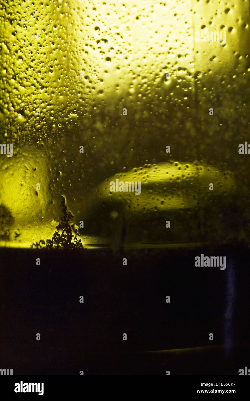 Wine sediment streaking side of wine bottle, extreme closeup Stock