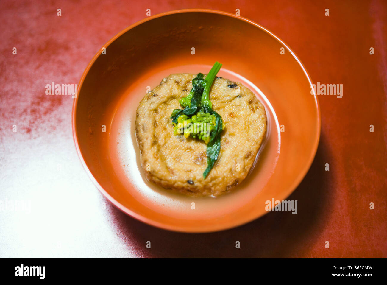 Japanese fried and poached tofu with young broccoli garnish Stock Photo