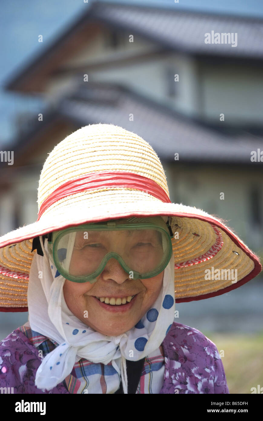 Portrait of an old lady with goggles cutting grass Stock Photo Alamy