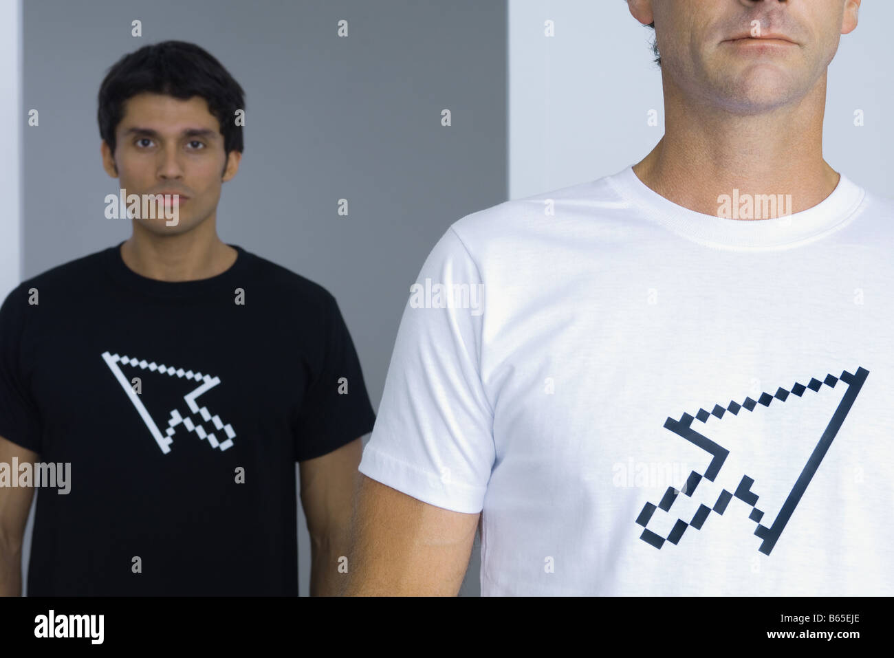 Men wearing tee-shirts printed with computer cursors, cropped Stock Photo