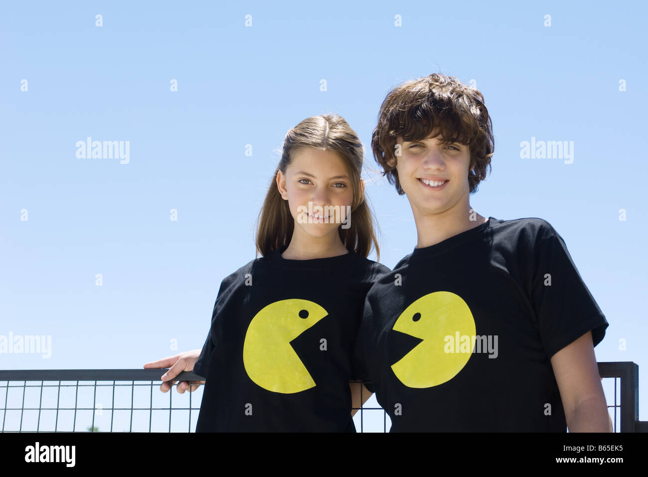 Young couple wearing tee-shirts printed 
