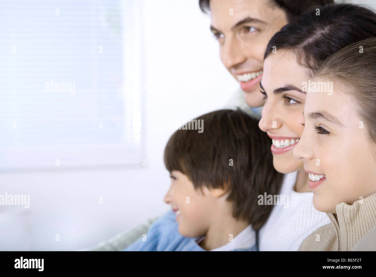 Sitting watching side by side looking away hi-res stock photography and ...