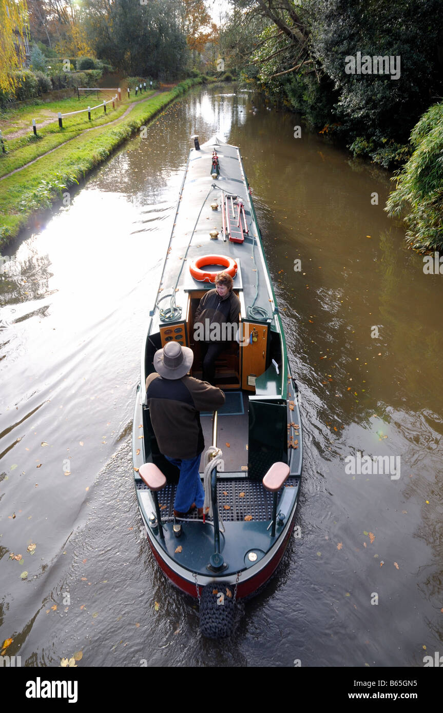 A narrowboat goes down the River Wey Navigation in Surrey England Stock Photo