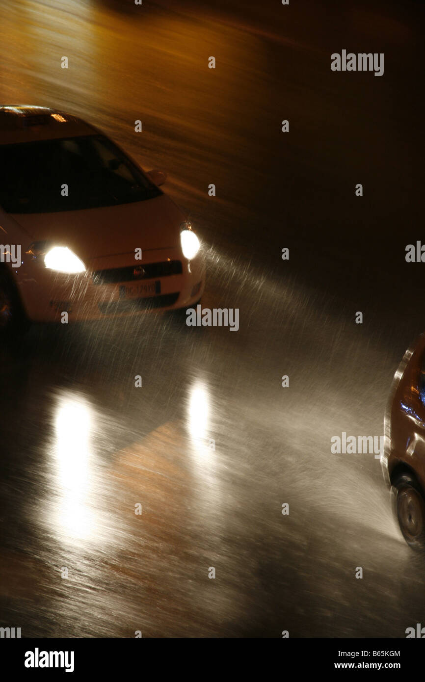 fast car driving in heavy rain at night in town Stock Photo - Alamy