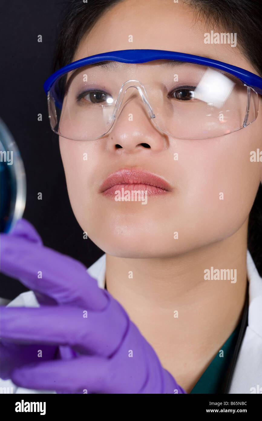 Microbiologist looks at a specimen Stock Photo Alamy