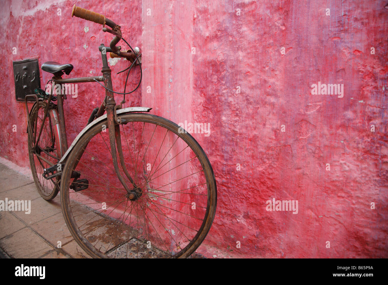 Bicycle near the pink wall, Rabat, Morocco, Africa Stock Photo
