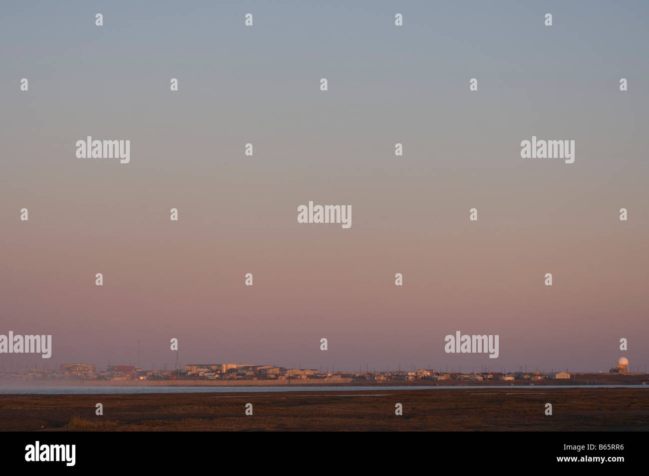 Inupiaq village of Kaktovik population around 300 glowing at sunrise