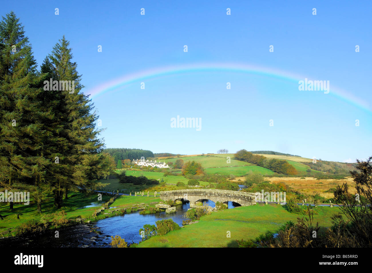 A rainbow above the East Dart River at Bellever on Dartmoor National Park Stock Photo