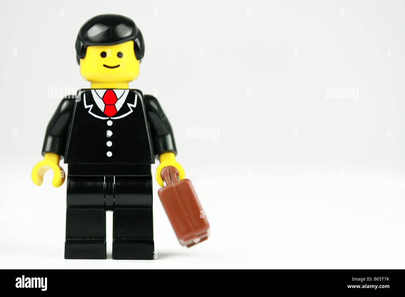 Happy Lego businessman - business concept Stock Photo