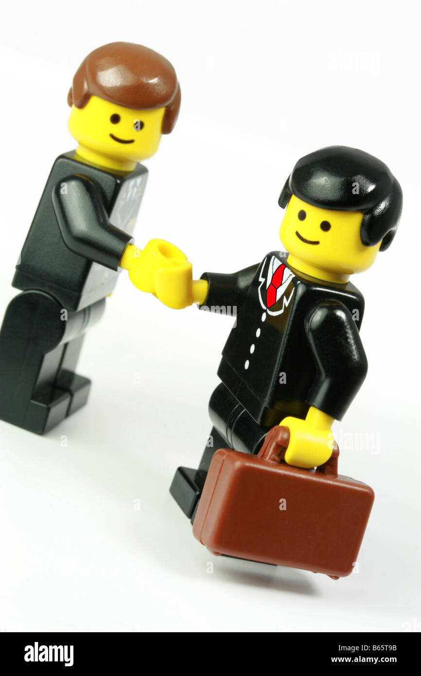 Lego businessman closing a deal - business success concept Stock Photo