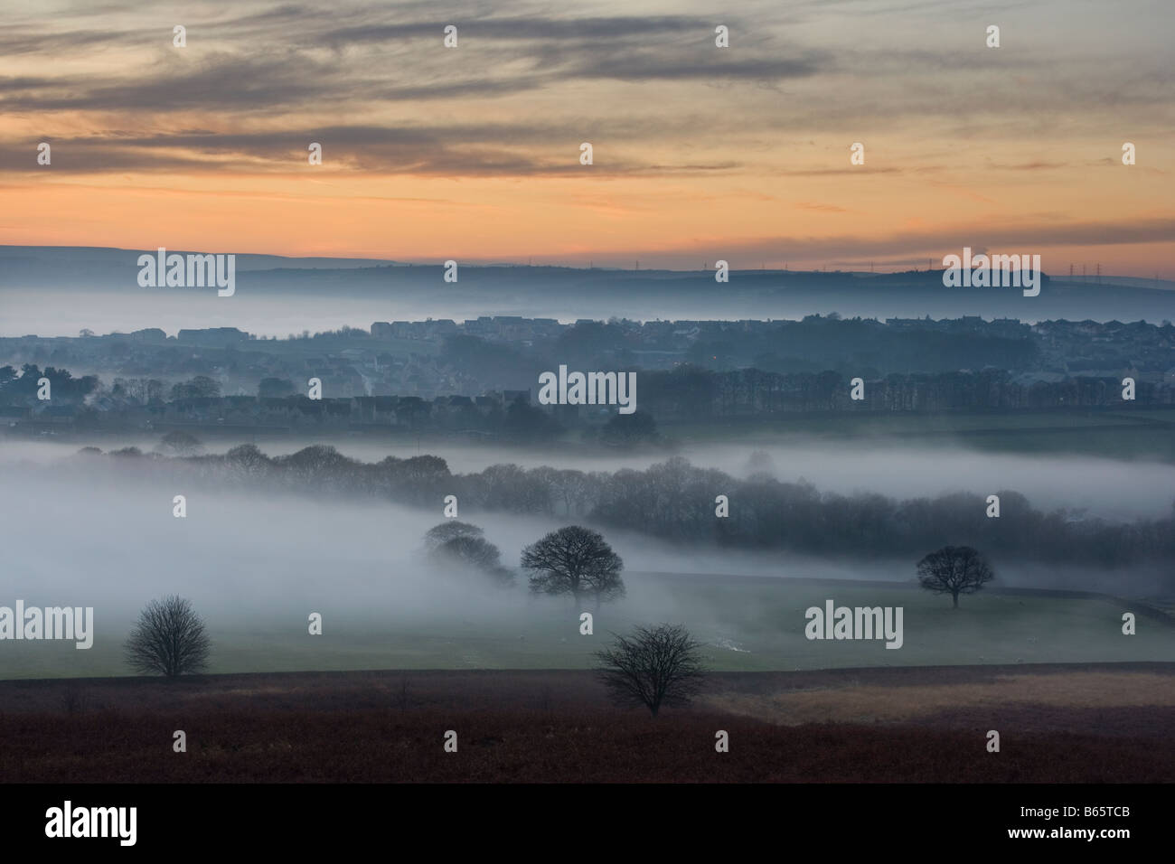 The view from Baildon Moor at sunset, as mist fills the Aire Valley at