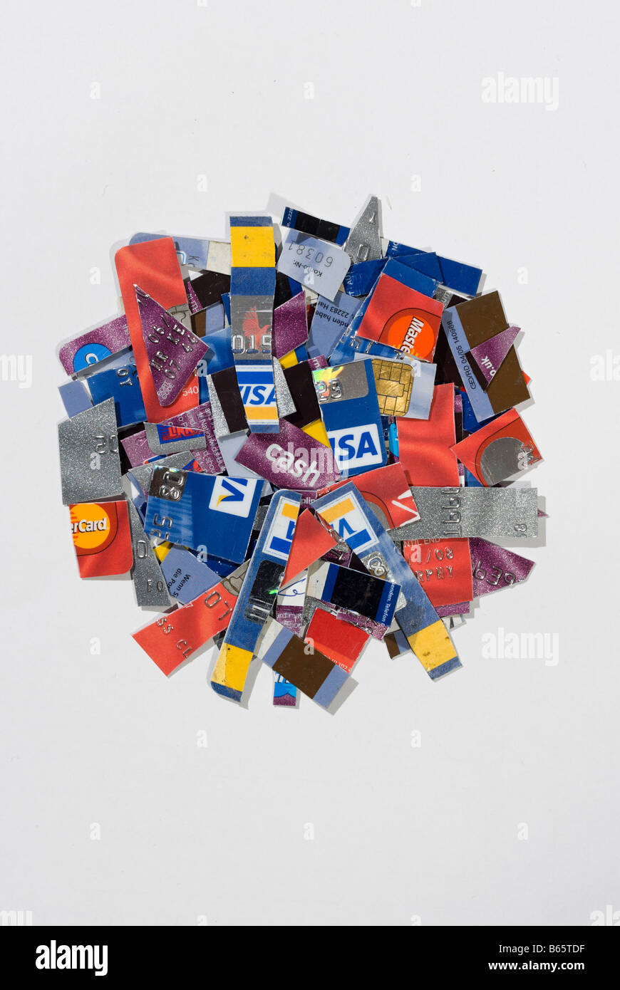 Circular pile of cut up assorted bank credit cards Stock Photo