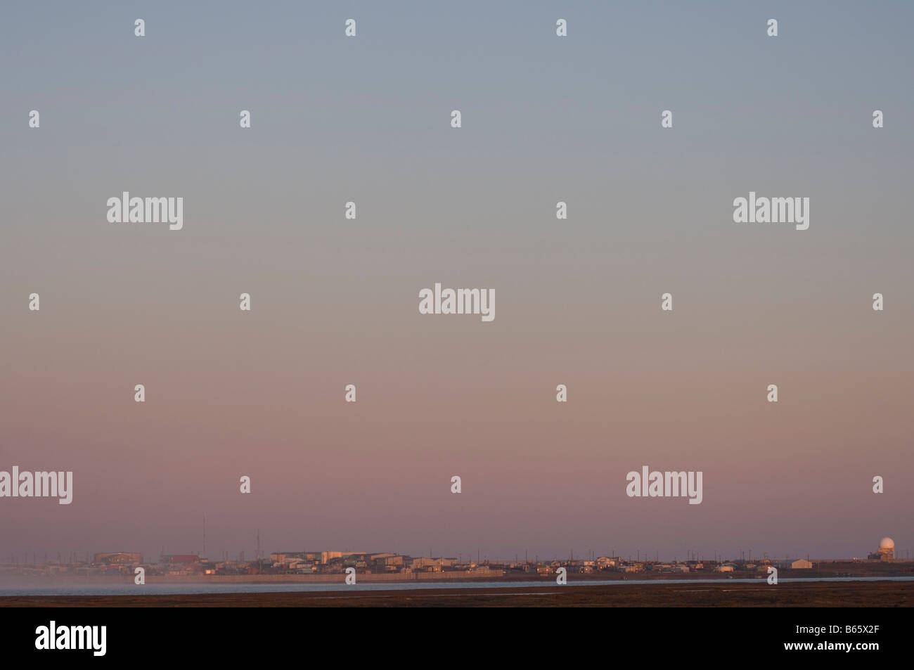 Inupiaq village of Kaktovik population around 300 glowing at sunrise