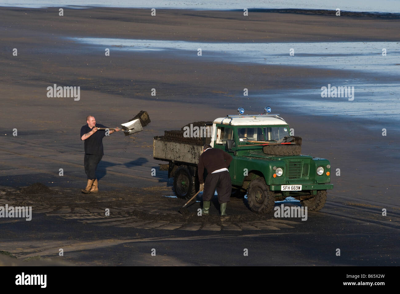 Collecting sea coal near Hartlepool Stock Photo