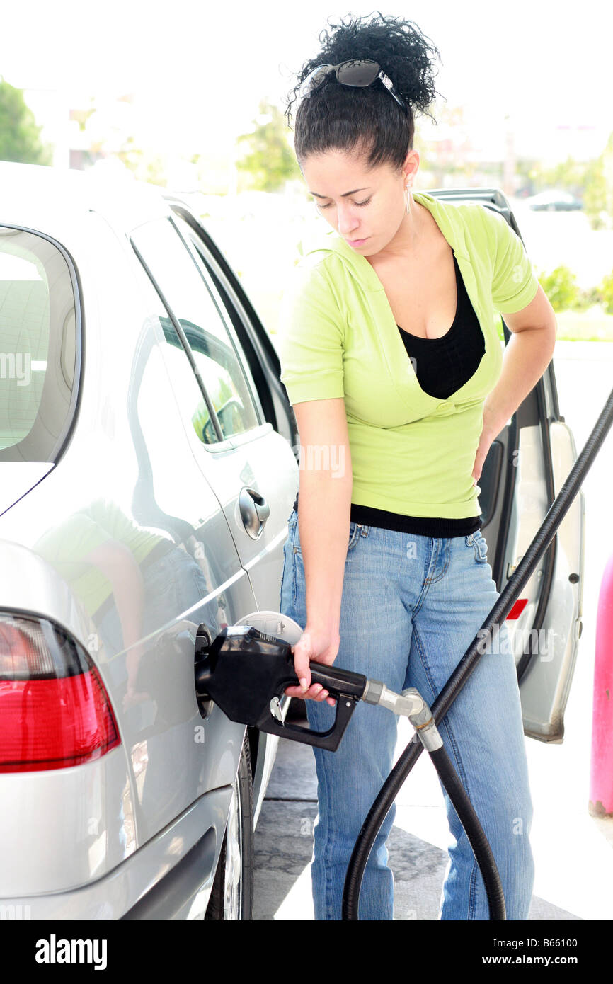 Woman filling her car
