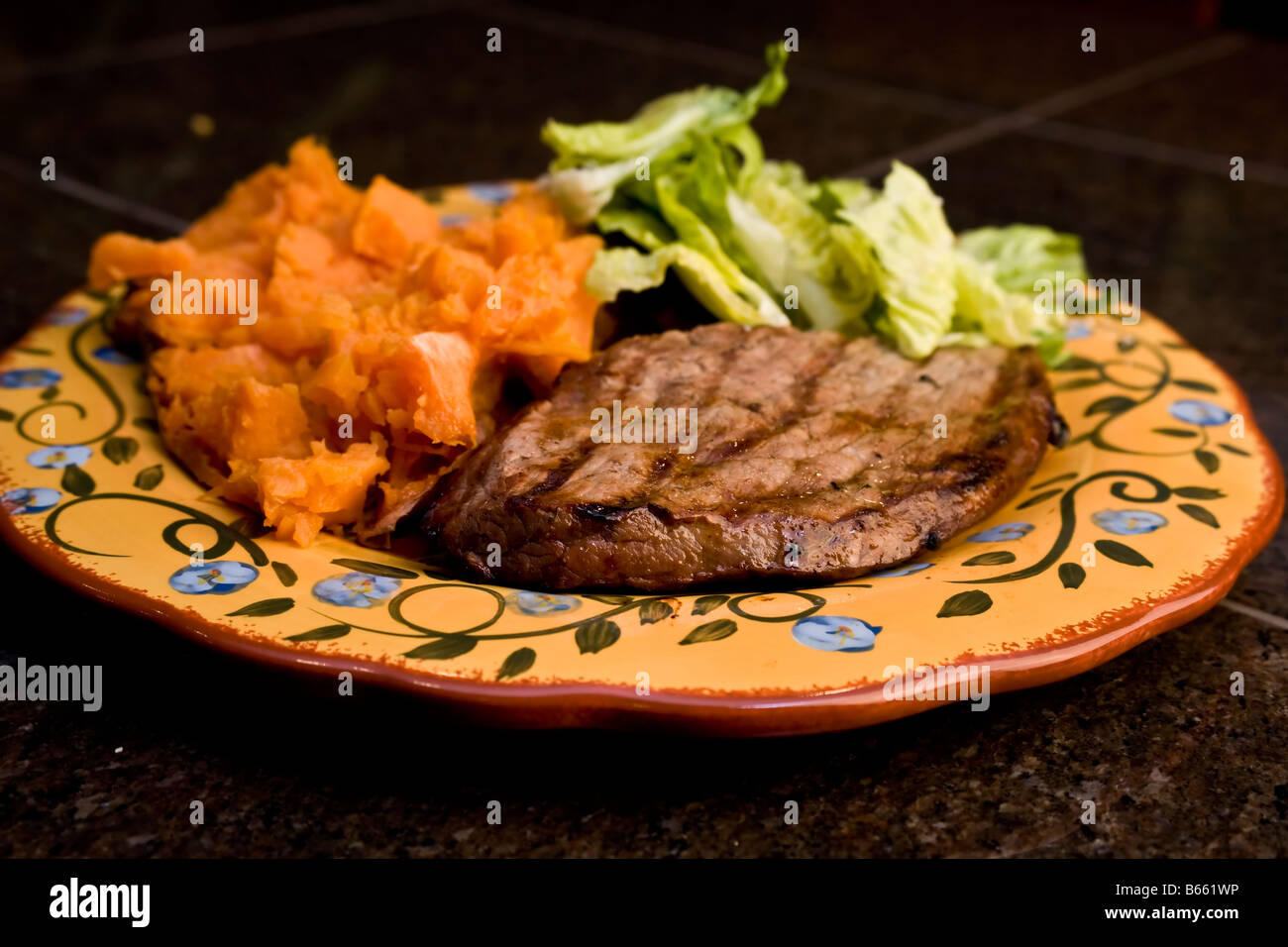 A steak and sweet potatoe dinner Stock Photo - Alamy