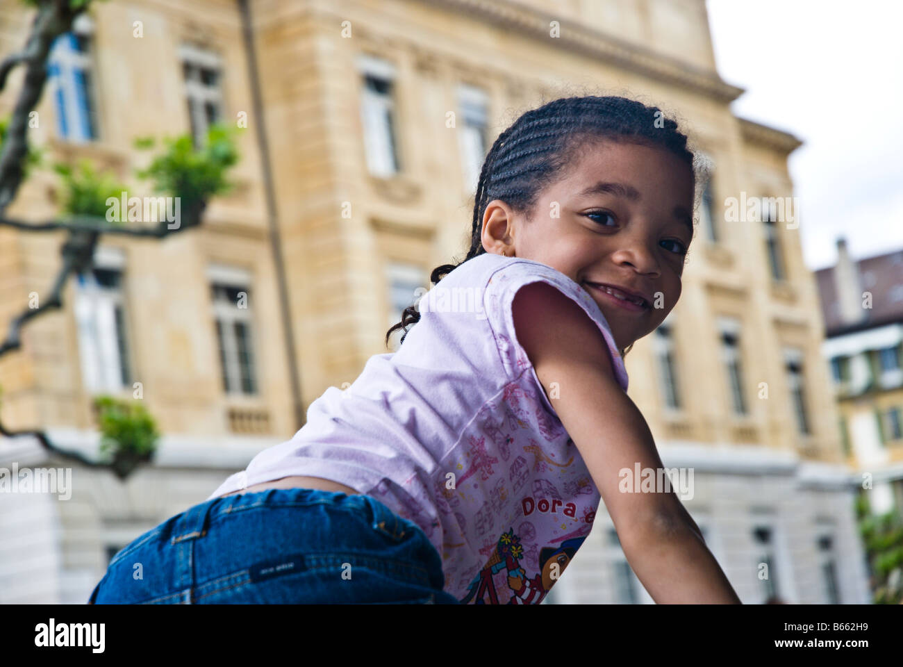 Young girl playing in the school yard Stock Photo