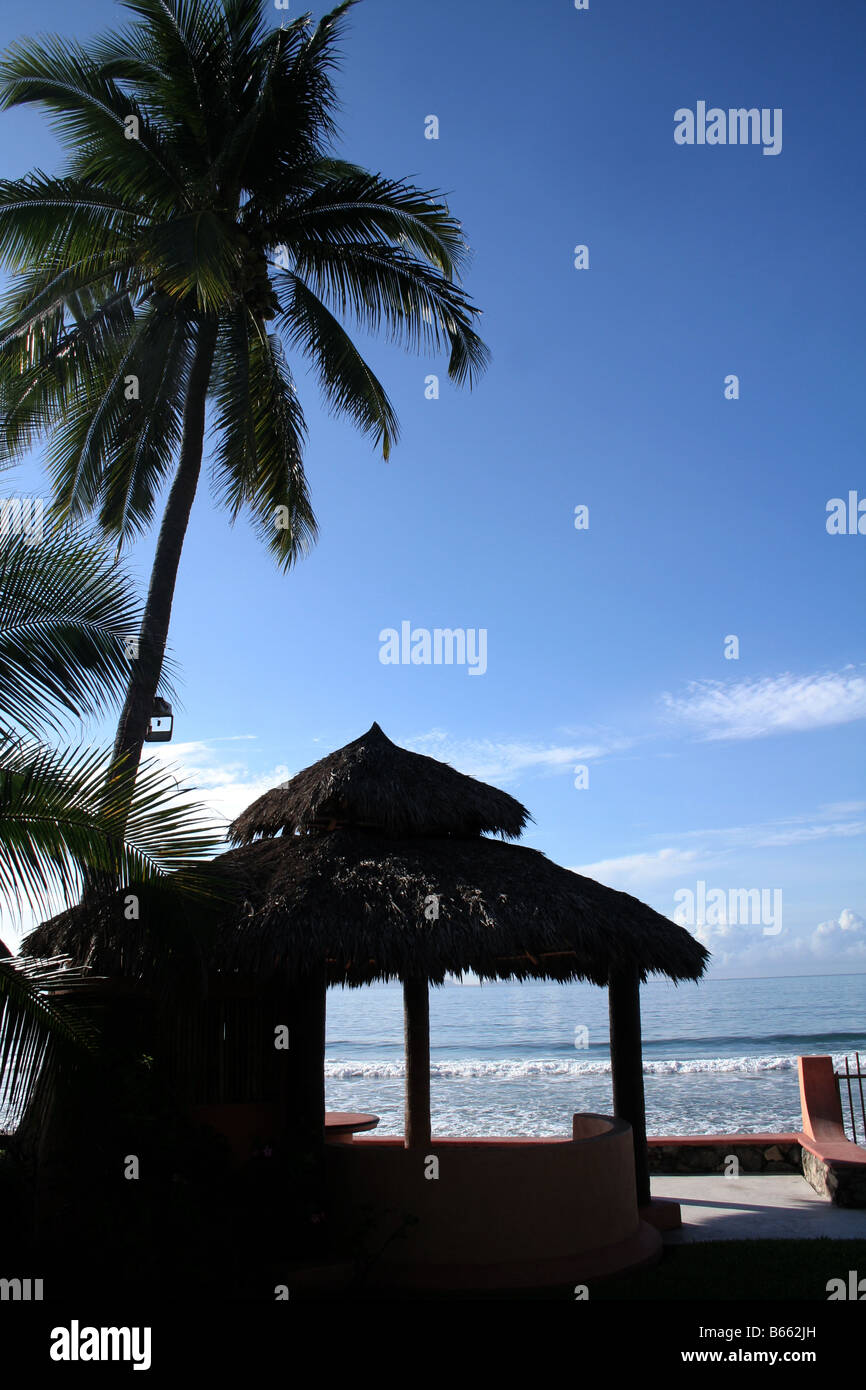 A mexican palapa in front of the ocean Stock Photo