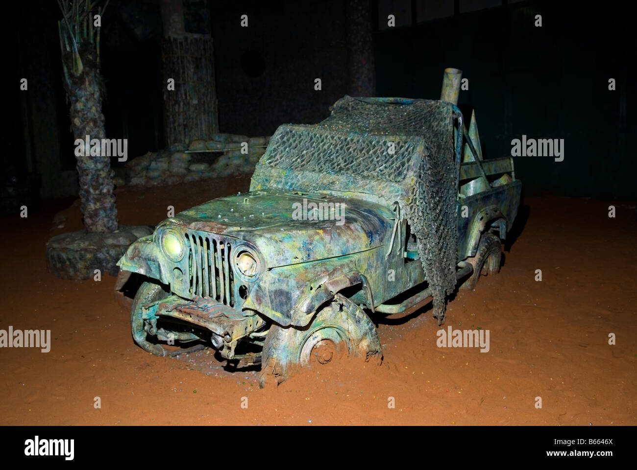 Destroyed army jeep vehicle used as prop in a paint ball field Stock Photo